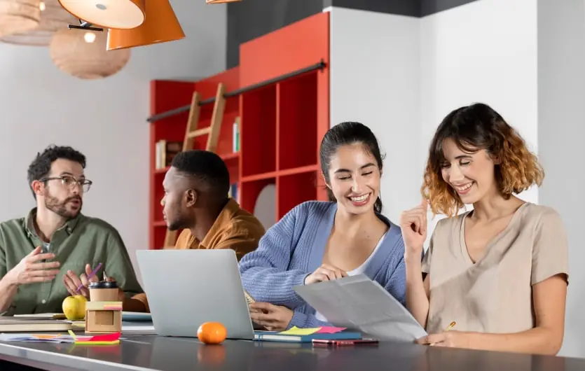 Team members shaking hands in an office